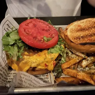 a sandwich and fries on a tray