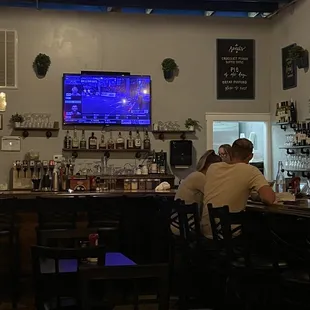 people sitting at the bar