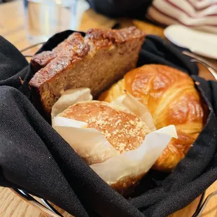 a basket of bread and pastries
