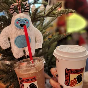 a person holding a cup of coffee