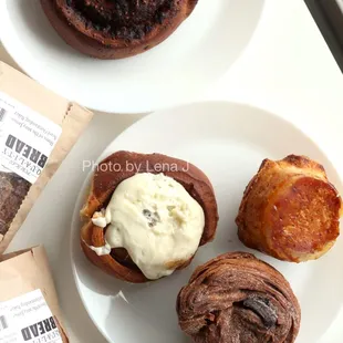 Tomato and Cheese Snail ($3), Cinnamon Roll ($5), Kouign Amann ($5.50), Chocolate Morning Brioche ($6), bread loaves