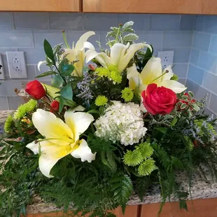 a bouquet of flowers on a kitchen counter