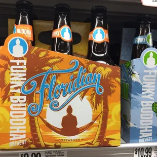 a variety of beer bottles on a shelf