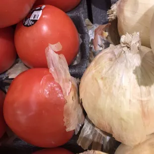 onions and tomatoes in a grocery store