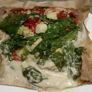 Tilapia with Dijon Creme sauce with quinoa blend, spinach, sun dried tomatoes, artichokes and bell peppers.