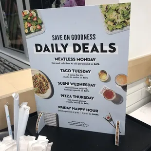 a sign for the daily deals