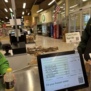 a man standing at a checkout counter