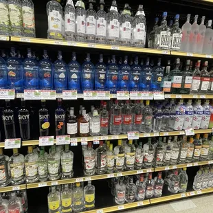 a shelf of liquor bottles