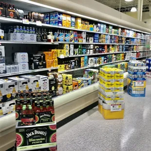 a grocery store aisle filled with beer