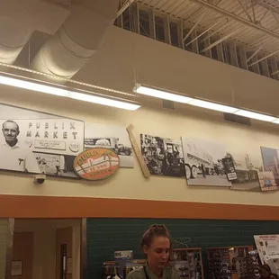 a woman standing in front of a counter