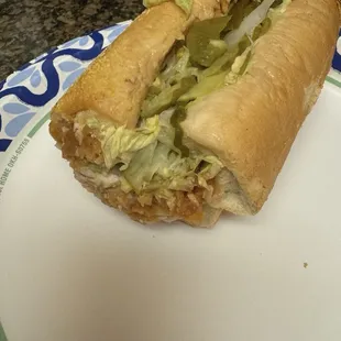 Chicken Tender (half).. hot honey Chicken, lettuce, garlic pickles, jalapenos, &amp; onions