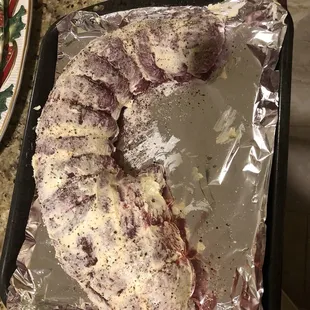 a piece of meat on a baking sheet