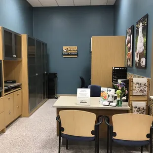 an office with a table and chairs