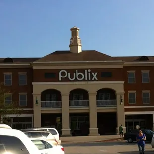 a large brick building with a clock tower