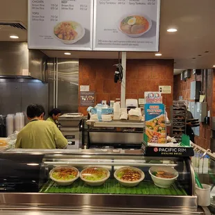 a man preparing food in a restaurant