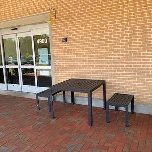 Outdoor seating by the entrance