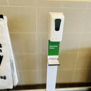 a paper towel dispenser in a public restroom