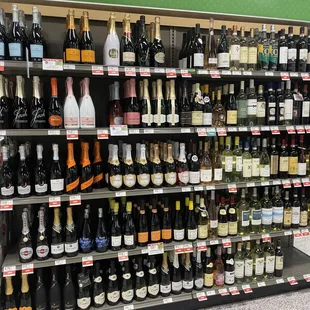 a large selection of alcohol bottles