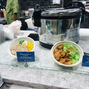 two bowls of food on a counter