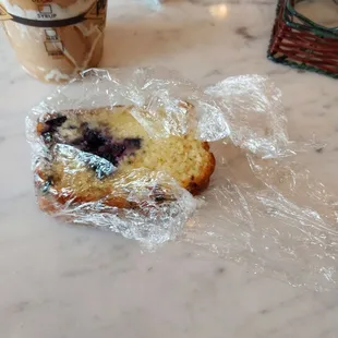 a muffin wrapped in plastic
