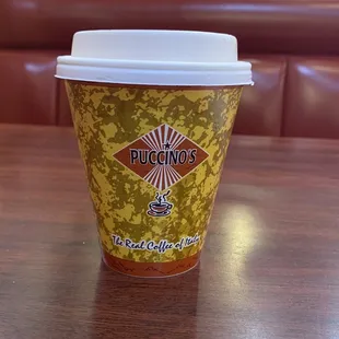 a coffee cup on a table