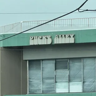 A classic sign, Puck's Alley.