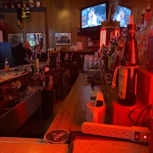 a view of a bar with a television in the background
