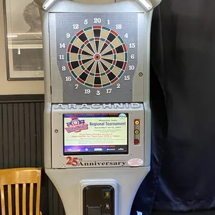 a game machine with a dart in the center