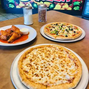 two pizzas on a table