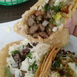 Now this is a steak taco. Corn tortillas with cilantro, onions and cheese n top it with their homemade salsa.