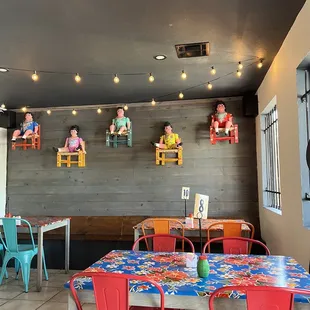 a dining area with red chairs