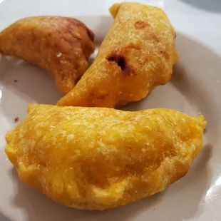 2 chicken empanadas and 1 beef empanada