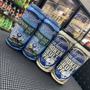 three cans of beer on a table