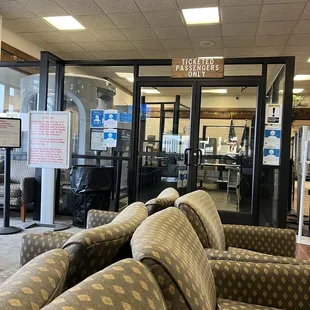 Waiting area outside of security, in from of restrooms.