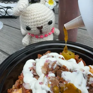 Pouring on the green sauce