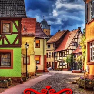 a cobblestone street with colorful buildings