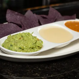 Three Amigos Dips: Guacamole, Queso, Queso Sabrocho