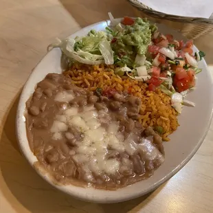 Molcajete Caliente came with rice, beans, pico de Gallo and guacamole.