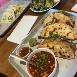 Picture are the shrimp tacos in the top of the photo, a generous side dish of veggies and then birrias - all SO delicious!!