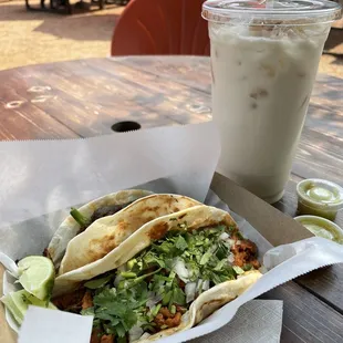 Al pastor taco and the Guaco taco with steak on flour tortillas. Also, the biggest (and best) horchata in town.
