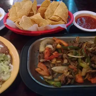 Lunch Fajitas with side of spicy salsa.