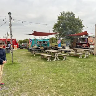 a man standing in front of a food truck