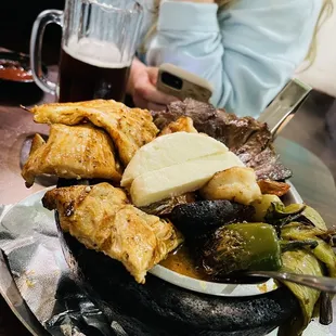 a plate of food with meat and vegetables