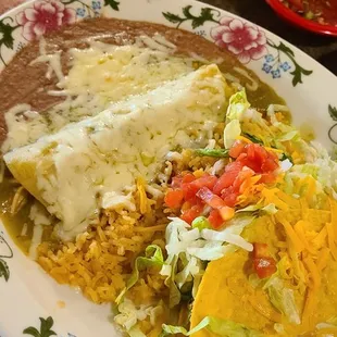 Enchilada with green sauce and a taco