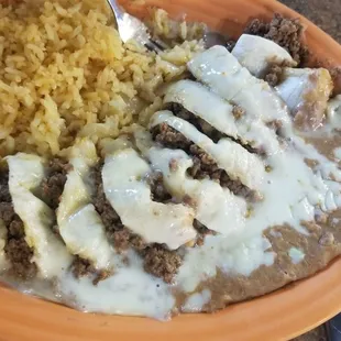Ground beef burrito with refried beans and rice