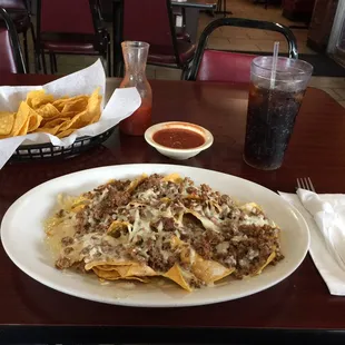 a plate of nachos and chips