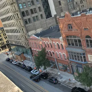 a view of a city street from a high rise building