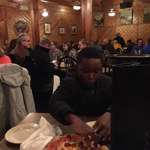 Nephew throwing down on some pizza..