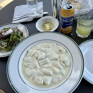 a plate of dumplings and salad