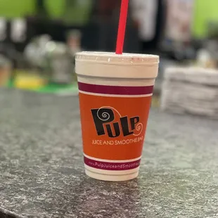 a drink in a paper cup